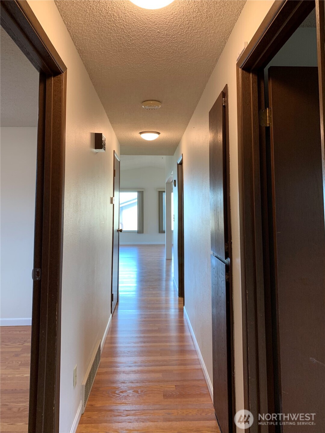 29818 4th Avenue Southwest Federal Way, WA 98023 - Photo 15 of 40 a view of a hallway with wooden floor