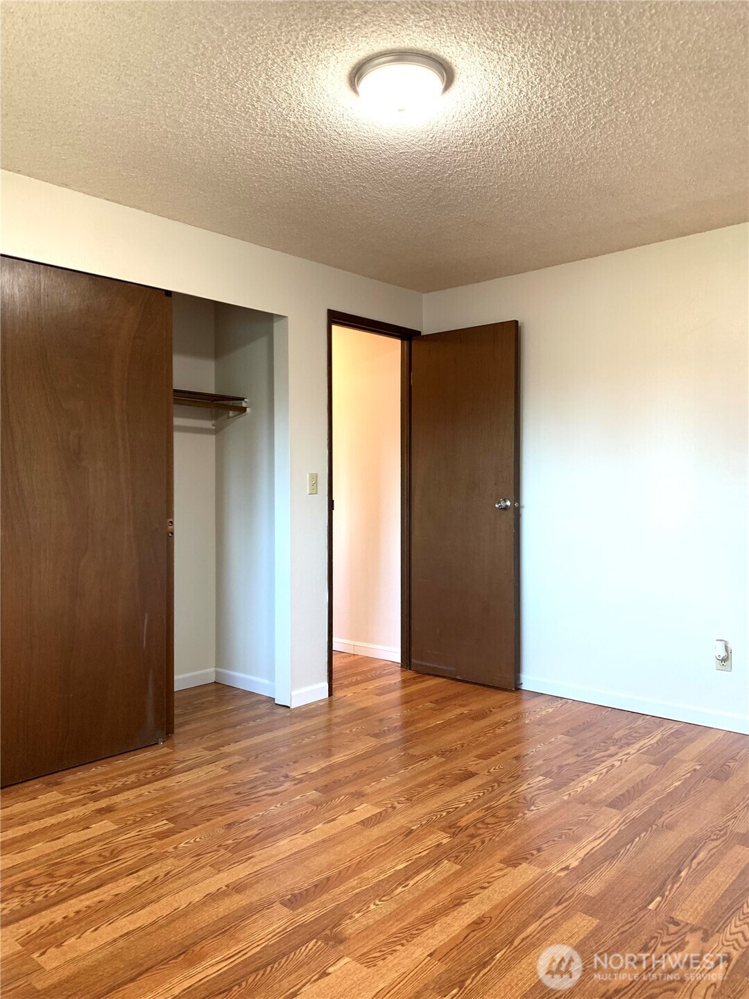 29818 4th Avenue Southwest Federal Way, WA 98023 - Photo 21 of 40 an empty room with wooden floor and windows
