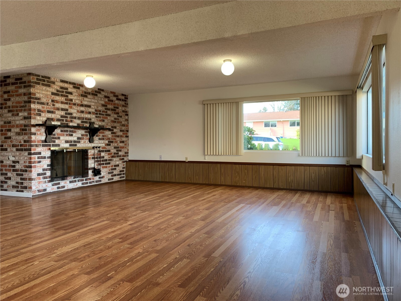 29818 4th Avenue Southwest Federal Way, WA 98023 - Photo 29 of 40 an empty room with wooden floor fireplace and windows