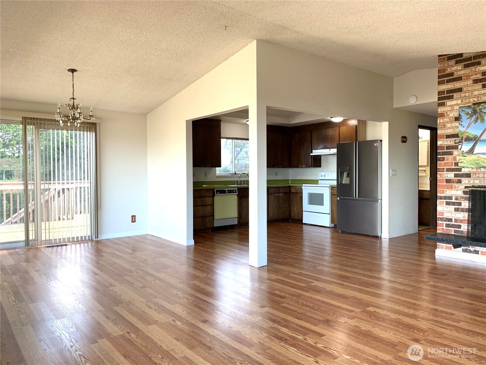 29818 4th Avenue Southwest Federal Way, WA 98023 - Photo 8 of 40 a view of a kitchen with wooden floor and a kitchen