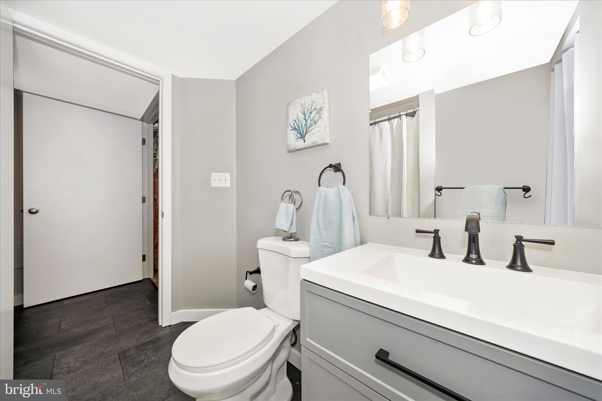 3 Contour Road Mount Airy, MD 21771 - Photo 36 of 54 a bathroom with a toilet sink and mirror