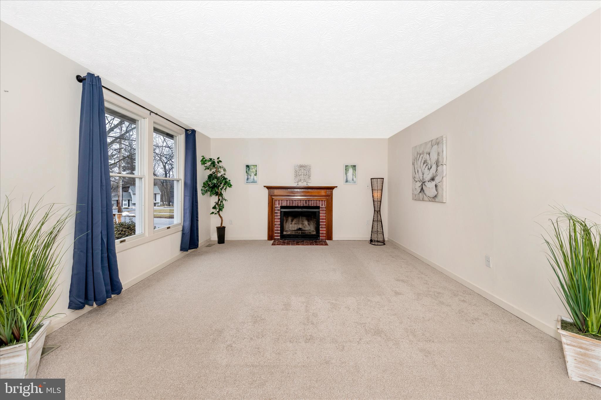 3 Contour Road Mount Airy, MD 21771 - Photo 7 of 54 a view of an empty room with a fireplace and a window