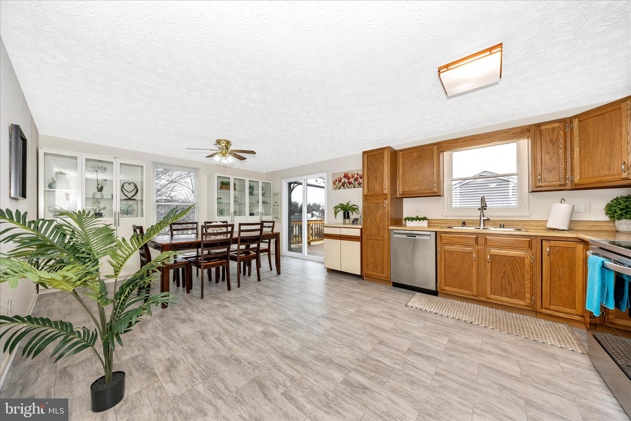3 Contour Road Mount Airy, MD 21771 - Photo 8 of 54 a kitchen with granite countertop a refrigerator cabinets and wooden floor