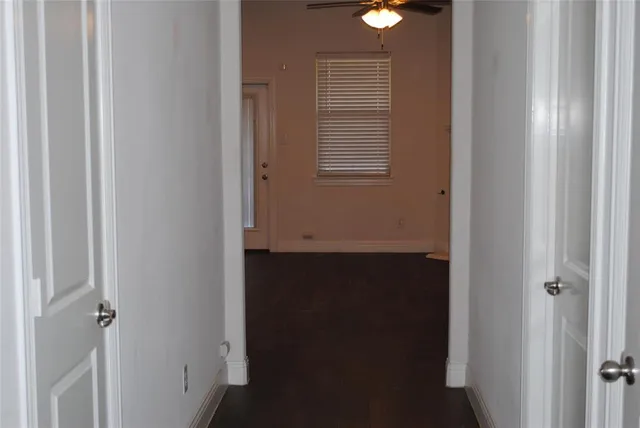 a view of hallway with windows