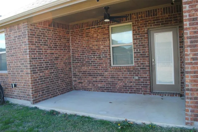 a view of a brick house with a small space