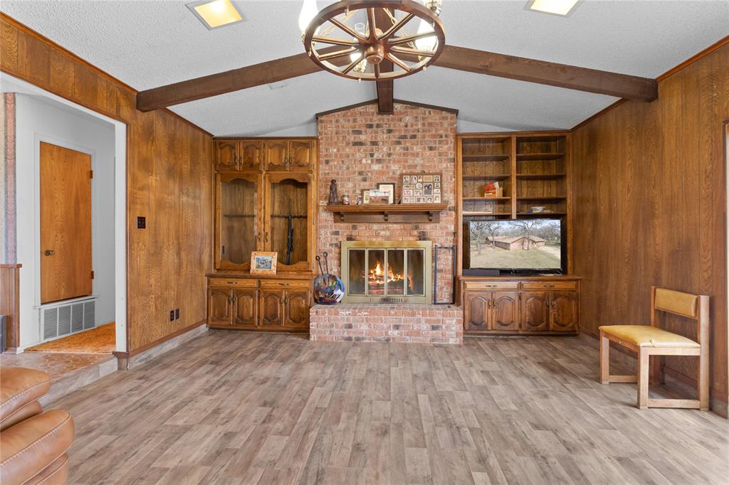 1447 Red Gate Road Mart, TX 76664 - Photo 34 of 38 a living room with furniture and a wooden floor