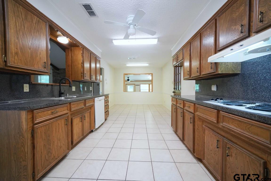 4505 Inverness Drive Tyler, TX 75703 - Photo 13 of 46 a large kitchen with stainless steel appliances granite countertop a sink and cabinets