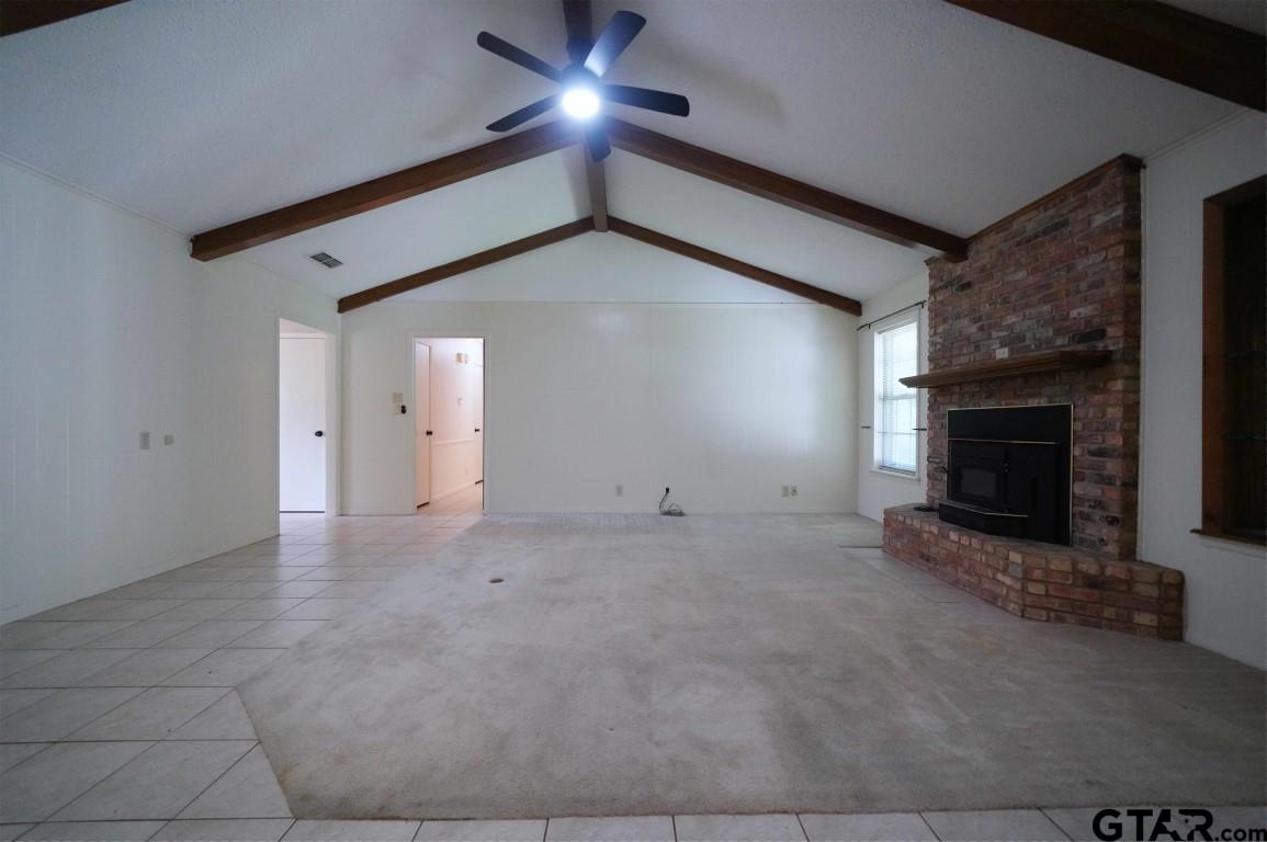 4505 Inverness Drive Tyler, TX 75703 - Photo 20 of 46 a view of empty room with fireplace and fan