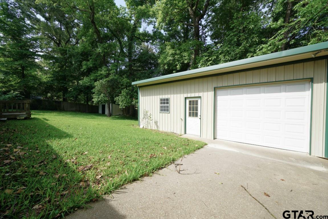 4505 Inverness Drive Tyler, TX 75703 - Photo 45 of 46 a view of a backyard with a garden