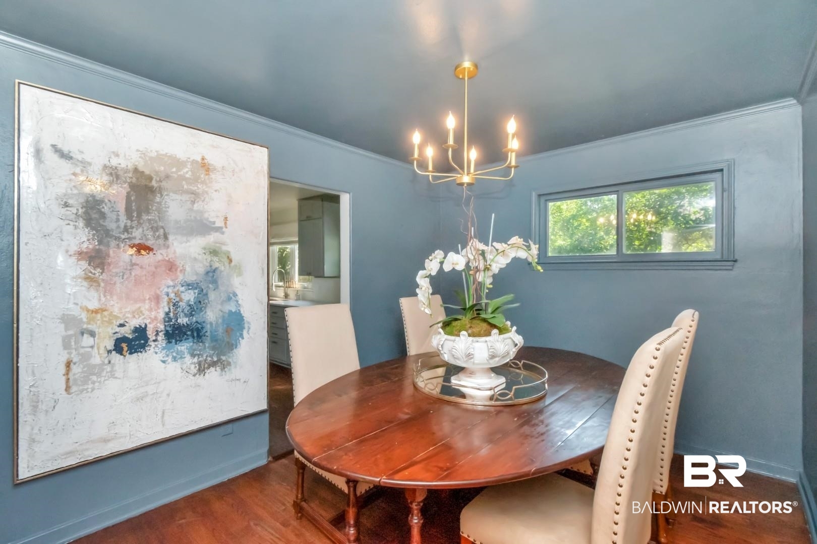 18 Princess Anne Road Mobile, AL 36608 - Photo 8 of 41 Dining room featuring wood finished floors, ornamental molding, and a chandelier