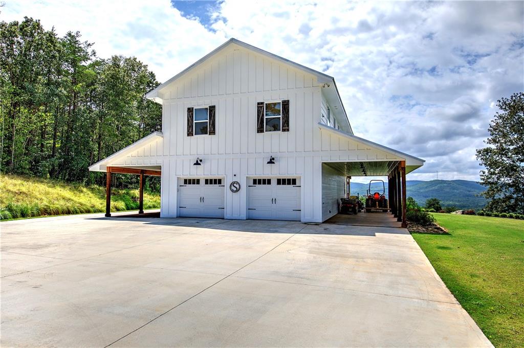 a front view of house with yard and trees