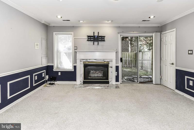 2 Parker Farm Court Silver Spring, MD 20906 - Photo 6 of 34 a view of livingroom with furniture a fireplace and window