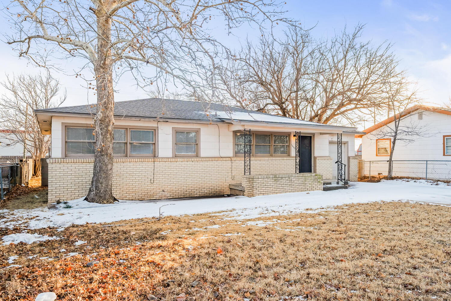 1609 39th Street Lubbock, TX 79412 - Photo 2 of 23 a house with a covered in snow