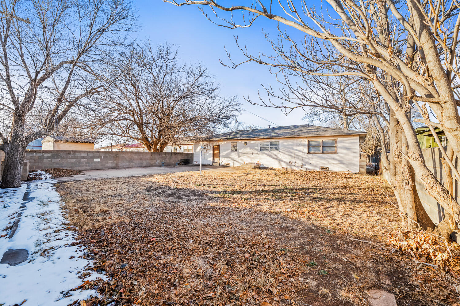 1609 39th Street Lubbock, TX 79412 - Photo 23 of 23 a view of yard covered with snow in front of house