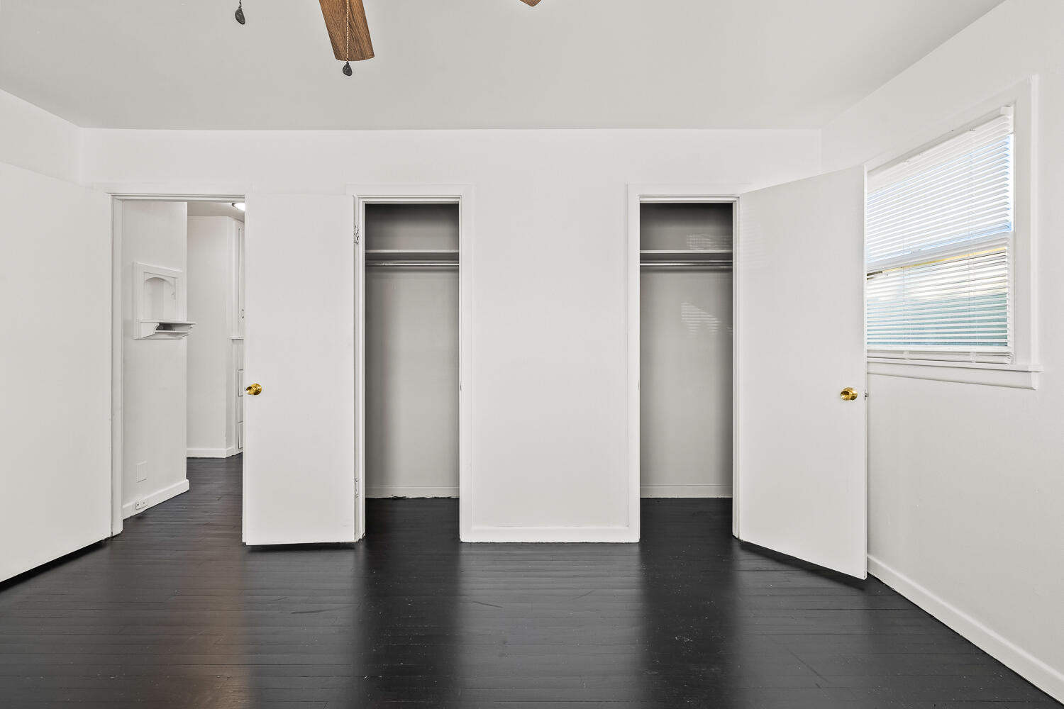 1609 39th Street Lubbock, TX 79412 - Photo 10 of 23 an empty room with wooden floor and closet