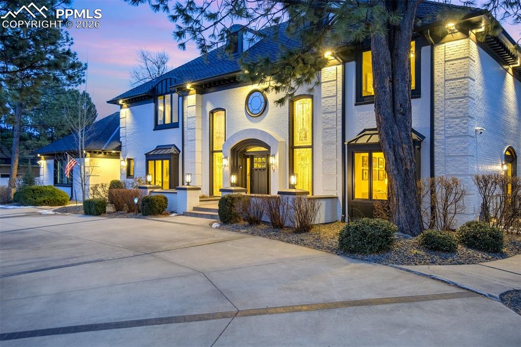17 Pourtales Road Colorado Springs, CO 80906 - Photo 1 of 50 a view of a brick house with large windows and a small yard