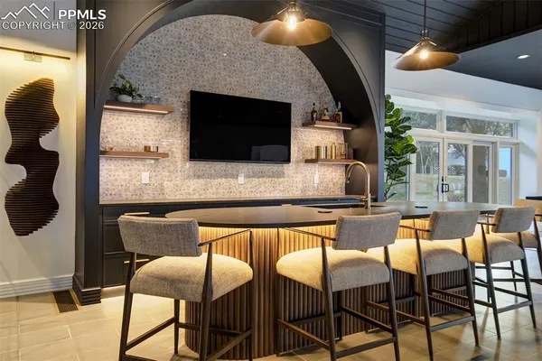 a dining room with furniture and a fireplace