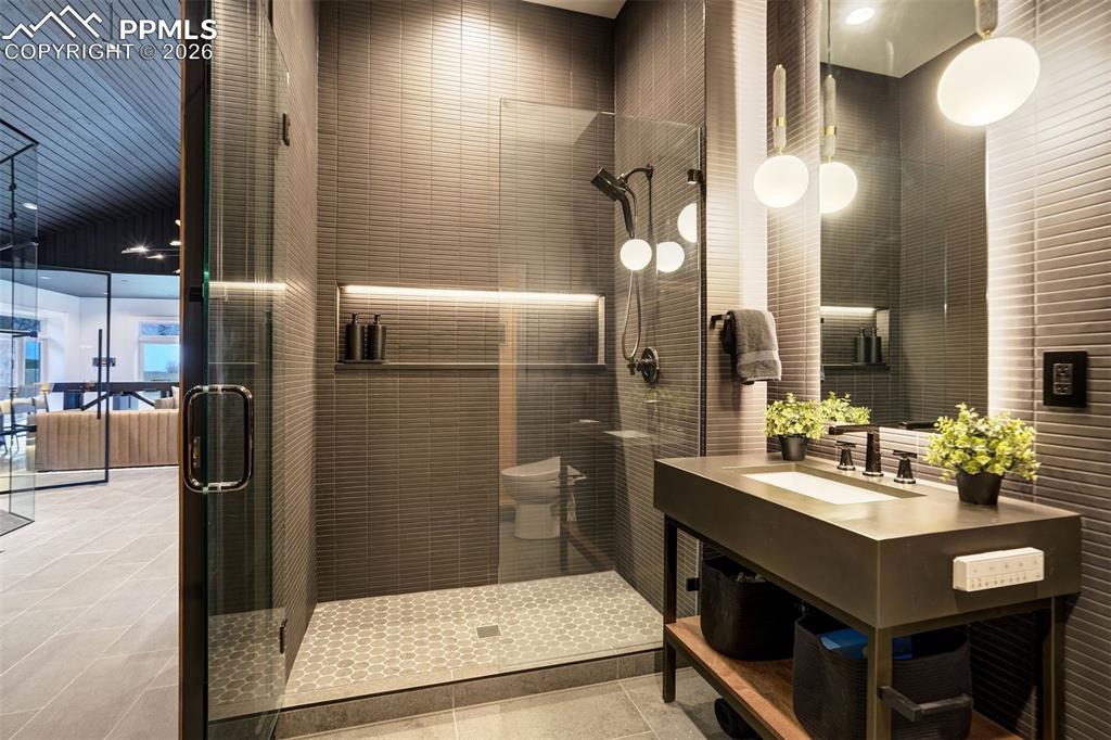 17 Pourtales Road Colorado Springs, CO 80906 - Photo 22 of 50 a bathroom with a sink a toilet and shower