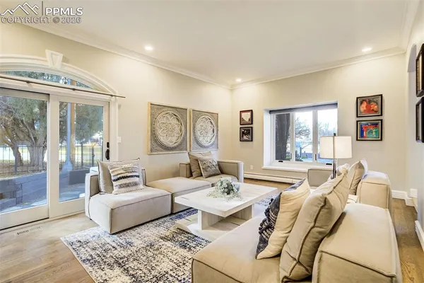 a living room with furniture and a table