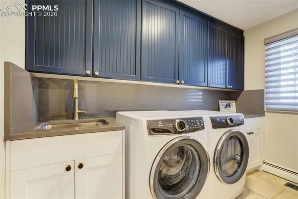 a view of storage and utility room with washer and dryer