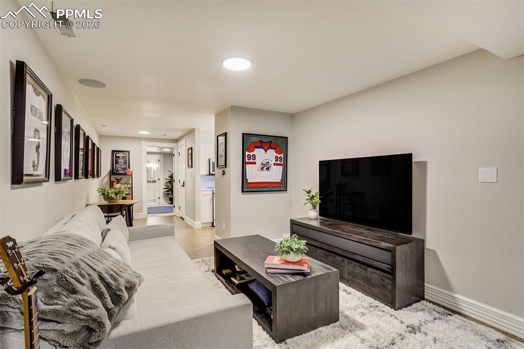 17 Pourtales Road Colorado Springs, CO 80906 - Photo 37 of 50 a living room with furniture and a flat screen tv