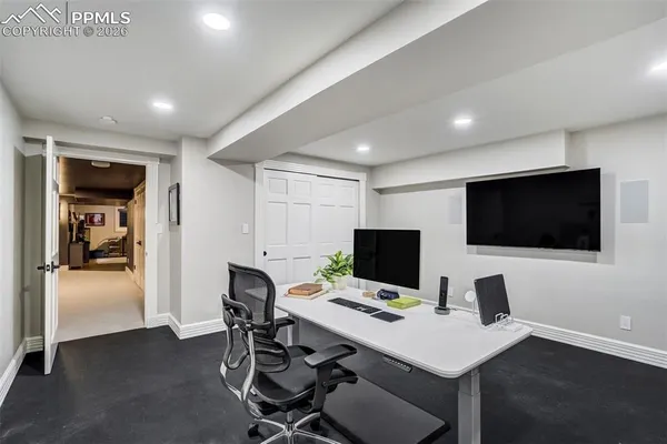 a view of a workspace with furniture