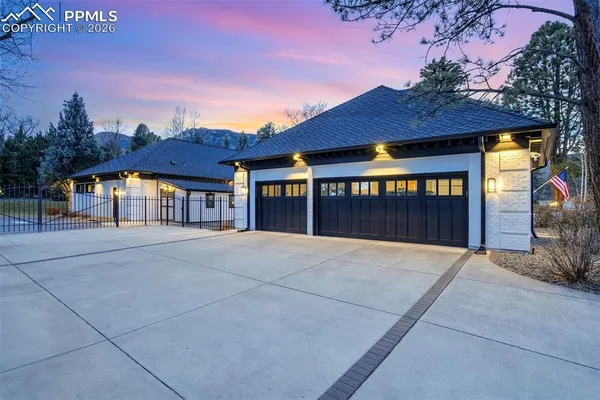 a view of an house with backyard space and balcony