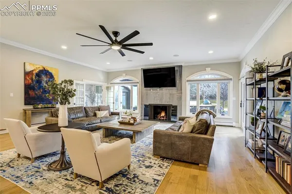 a living room with fireplace furniture and a flat screen tv