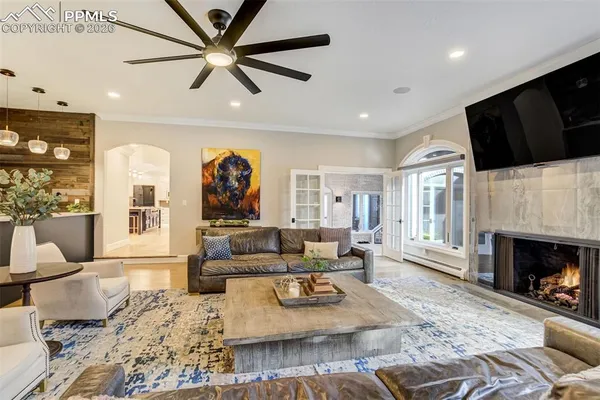 a living room with fireplace furniture and a fireplace