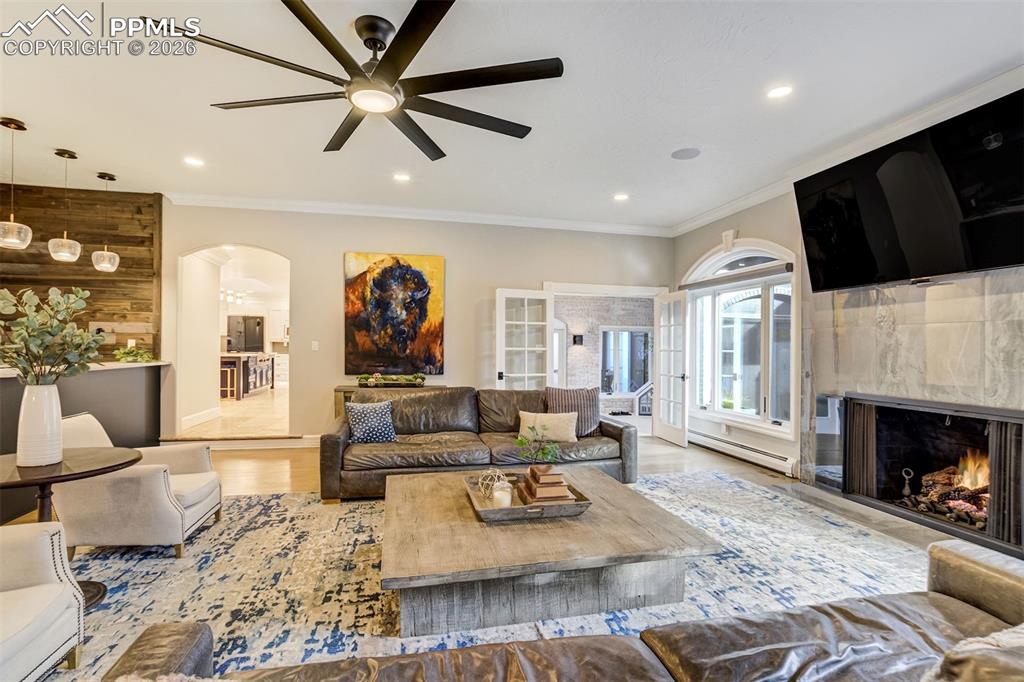 17 Pourtales Road Colorado Springs, CO 80906 - Photo 7 of 50 a living room with fireplace furniture and a fireplace