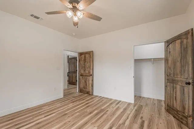 a view of a patio with a table chairs and a backyard