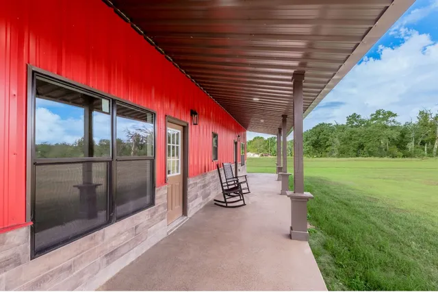 a view of field with trees in the background