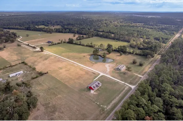 a bedroom with double bed and a dresser