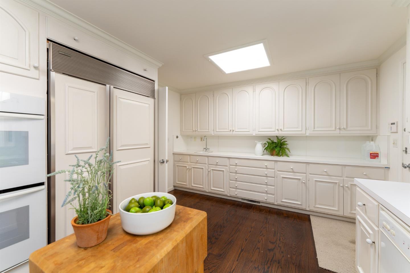 175 Isabella Avenue Atherton, CA 94027 - Photo 14 of 38 a kitchen with a potted plant on the counter