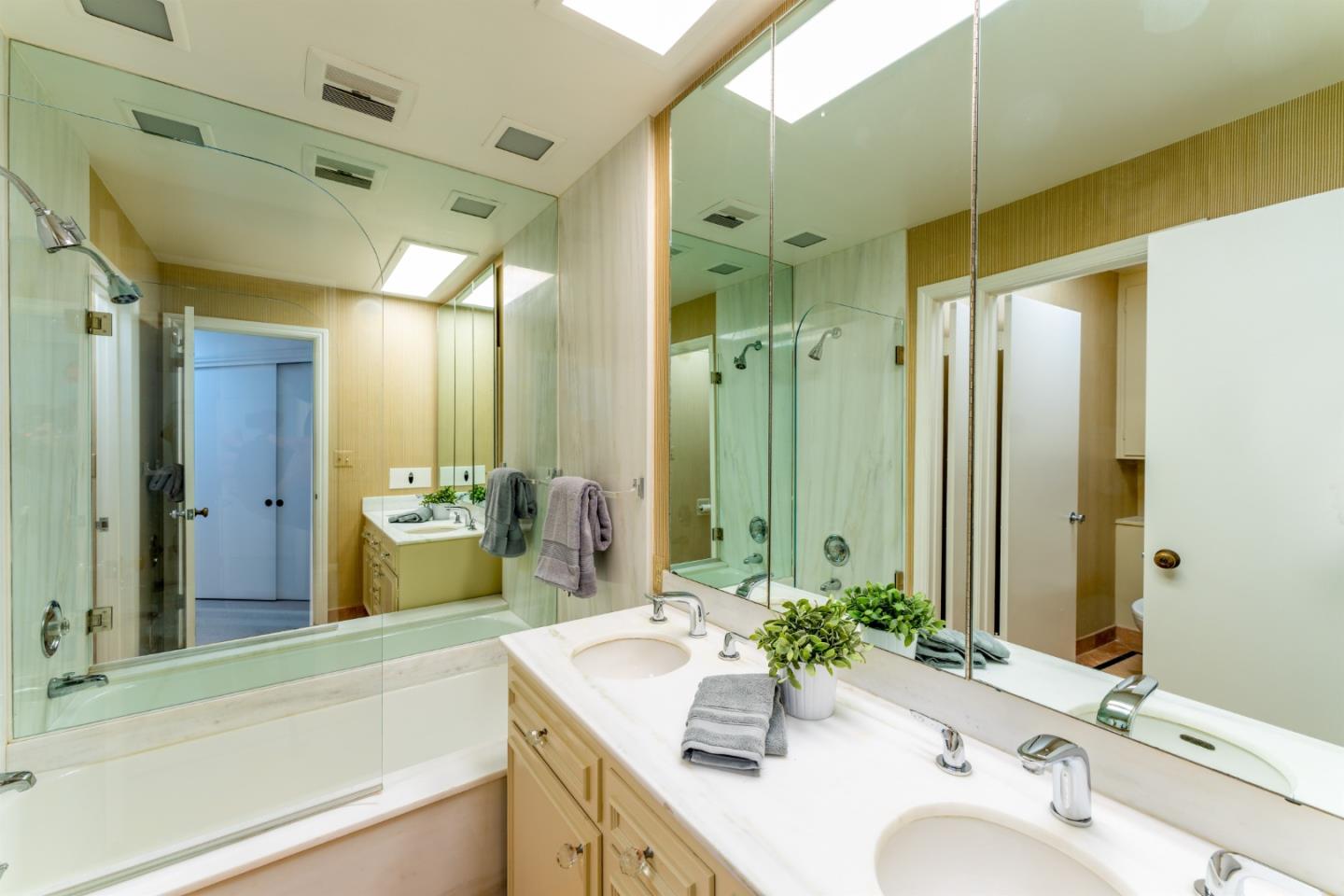 175 Isabella Avenue Atherton, CA 94027 - Photo 17 of 38 a bathroom with a sink and a mirror