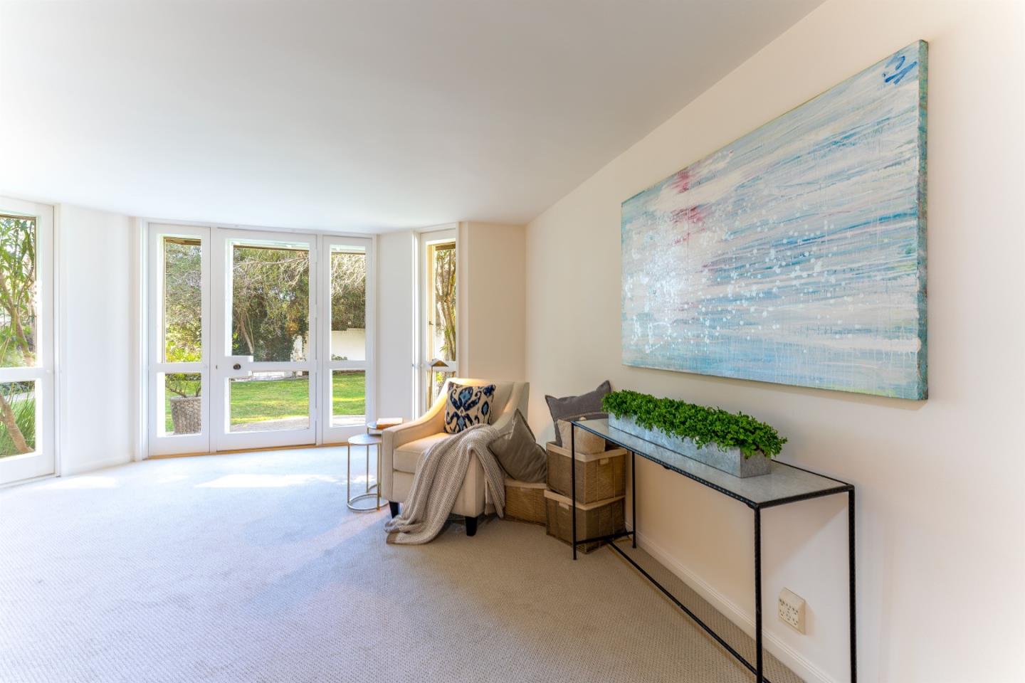 175 Isabella Avenue Atherton, CA 94027 - Photo 19 of 38 a living room with furniture and large windows