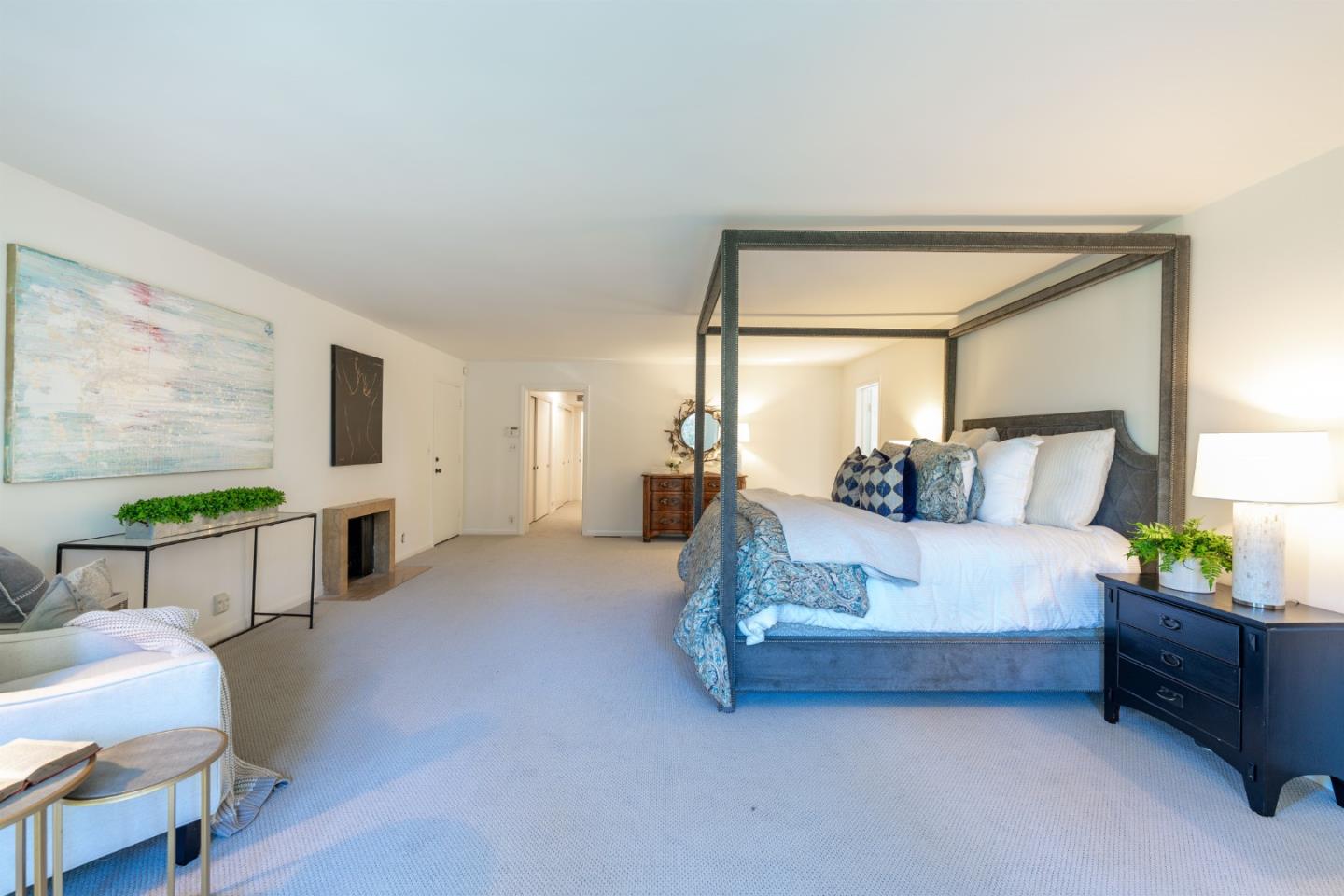 175 Isabella Avenue Atherton, CA 94027 - Photo 20 of 38 a spacious bedroom with a bed window table and chair