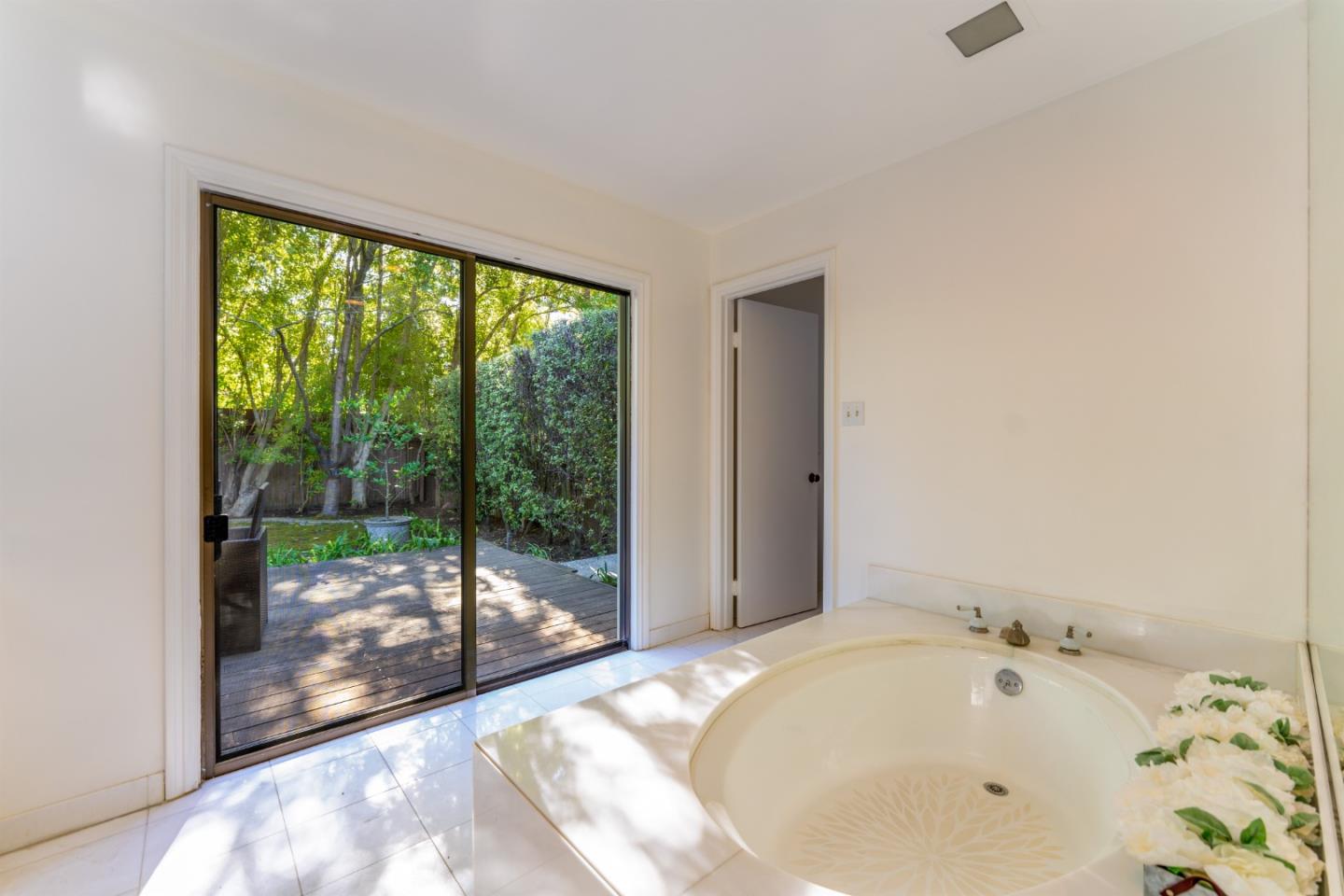 175 Isabella Avenue Atherton, CA 94027 - Photo 22 of 38 a bathroom with a bathtub and shower