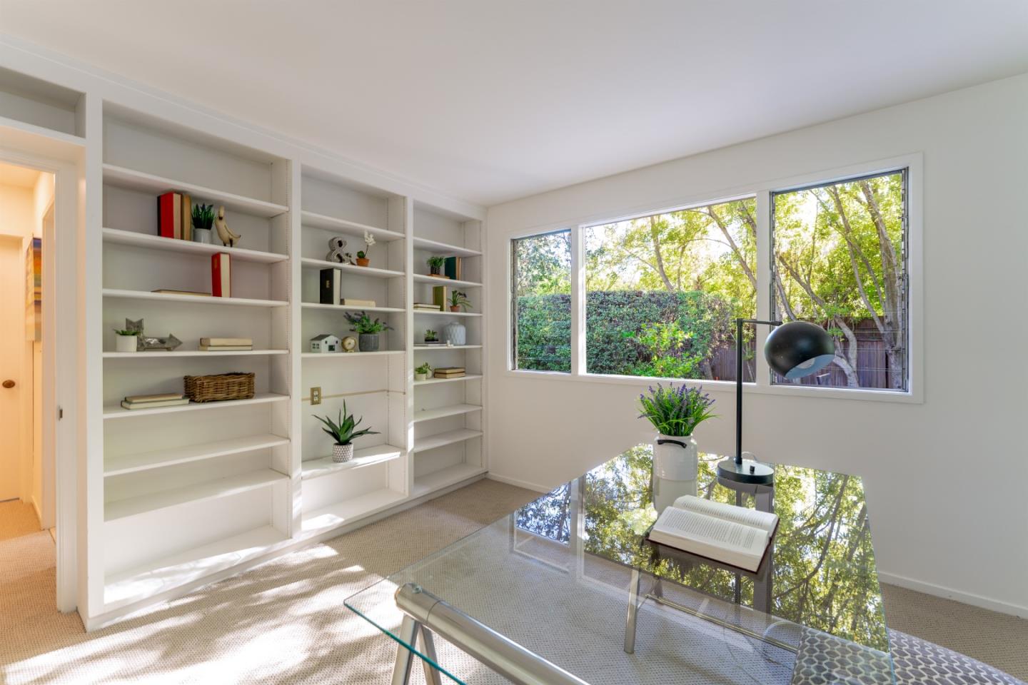 175 Isabella Avenue Atherton, CA 94027 - Photo 24 of 38 a living room with furniture and a book shelf