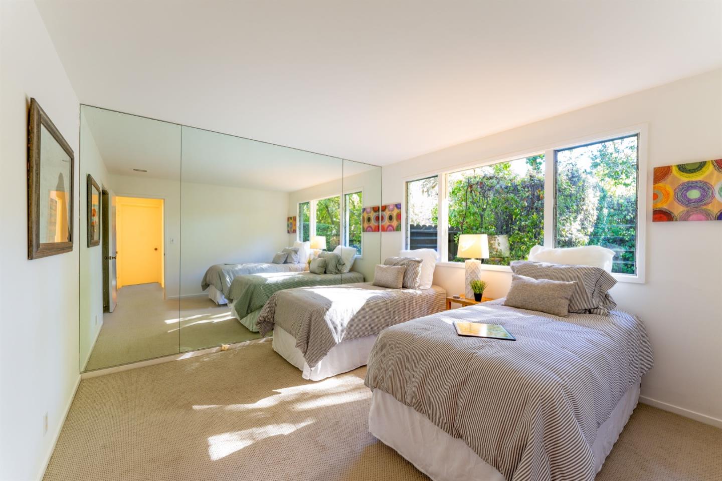 175 Isabella Avenue Atherton, CA 94027 - Photo 25 of 38 a bedroom with two beds and large windows