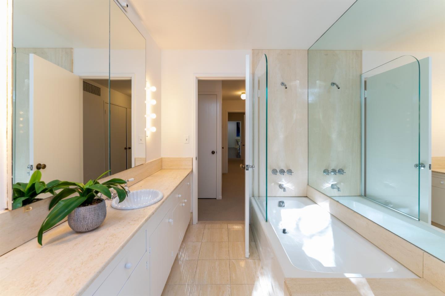 175 Isabella Avenue Atherton, CA 94027 - Photo 26 of 38 a bathroom with a tub shower and sink