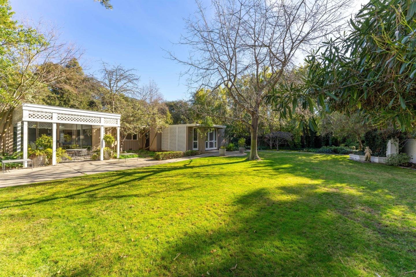175 Isabella Avenue Atherton, CA 94027 - Photo 29 of 38 a view of a house with swimming pool and a yard