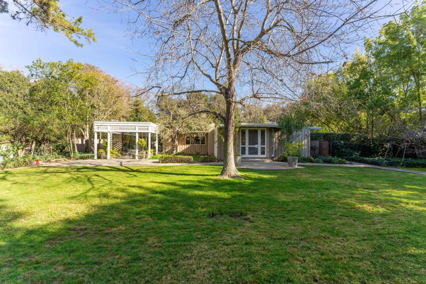 175 Isabella Avenue Atherton, CA 94027 - Photo 30 of 38 a front view of a house with a garden