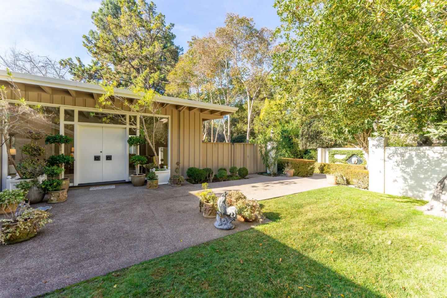 175 Isabella Avenue Atherton, CA 94027 - Photo 6 of 38 a view of a backyard with large trees and plants