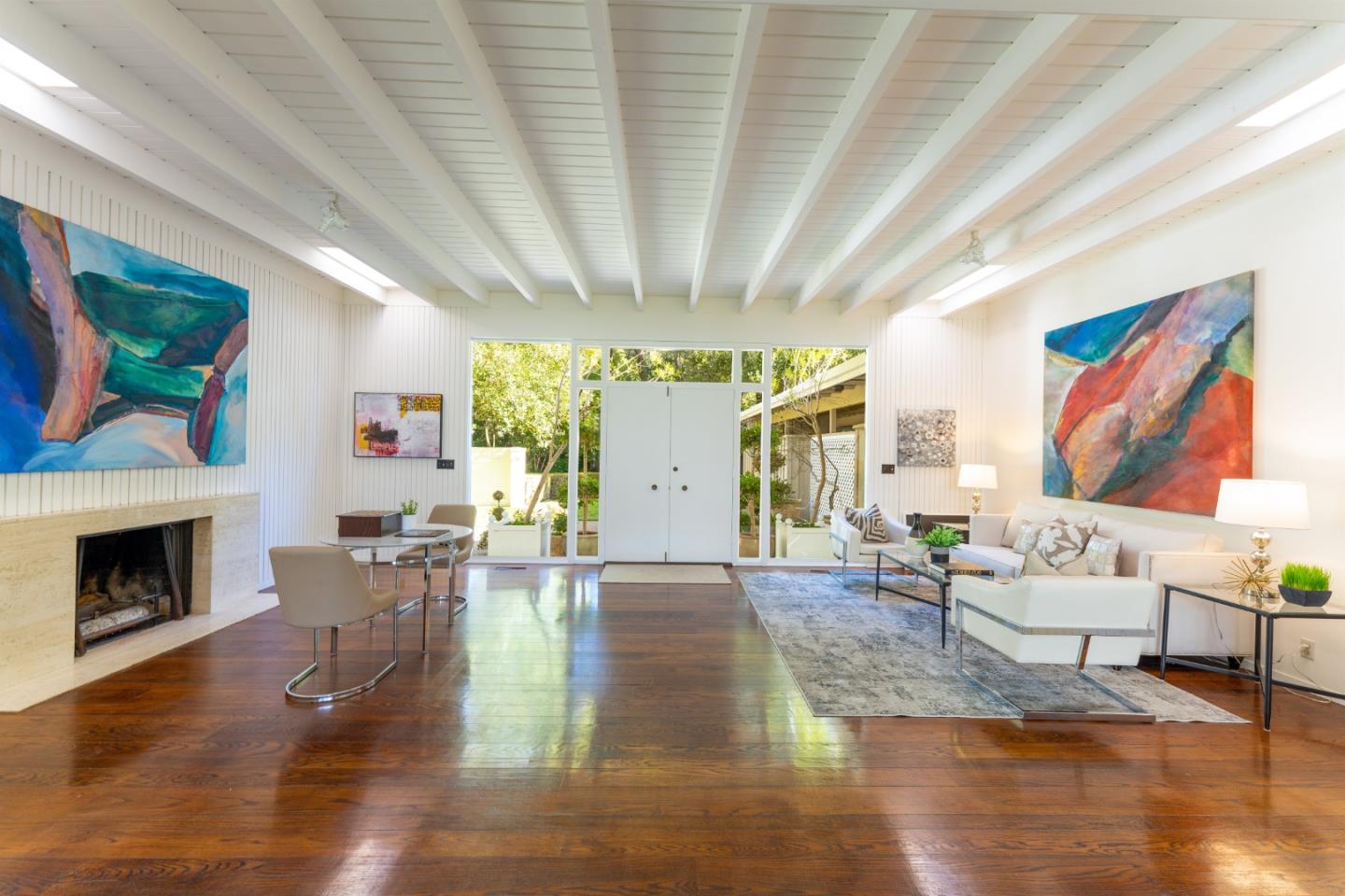175 Isabella Avenue Atherton, CA 94027 - Photo 7 of 38 a living room with fireplace furniture and a wooden floor