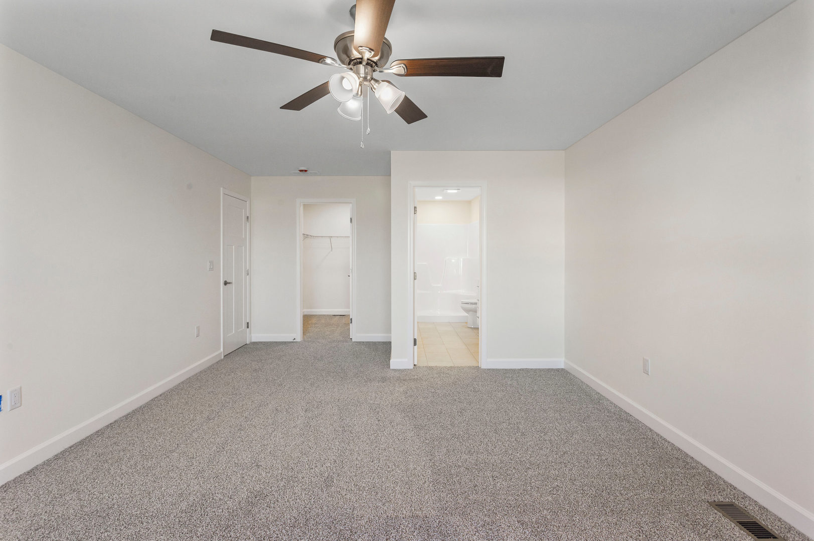 504 Patterson Drive Bloomington, IL 61701 - Photo 12 of 26 an empty room with a ceiling fan and a window