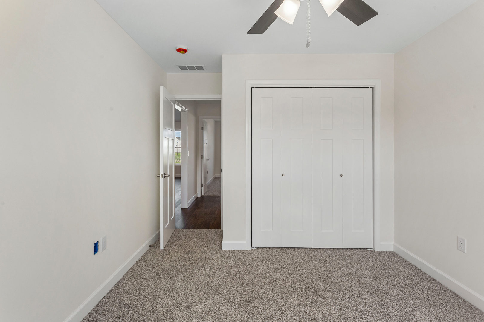 504 Patterson Drive Bloomington, IL 61701 - Photo 17 of 26 an empty room with chandelier fan