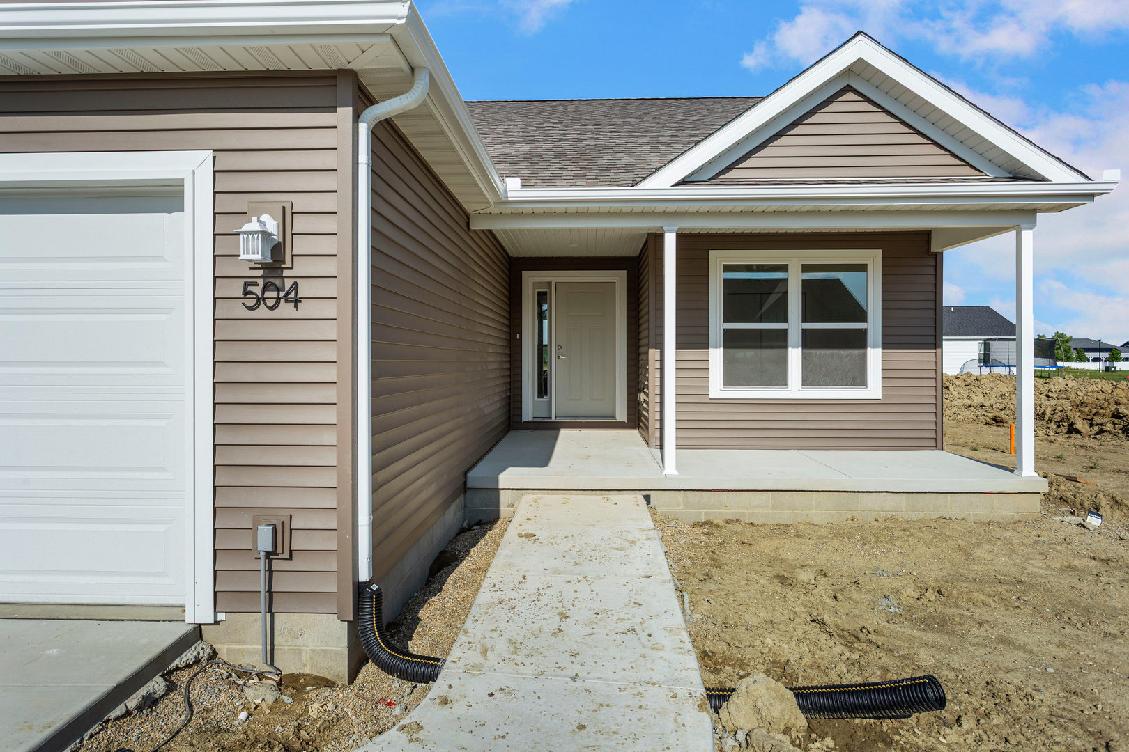 504 Patterson Drive Bloomington, IL 61701 - Photo 3 of 26 a view of a house with wooden door and a window