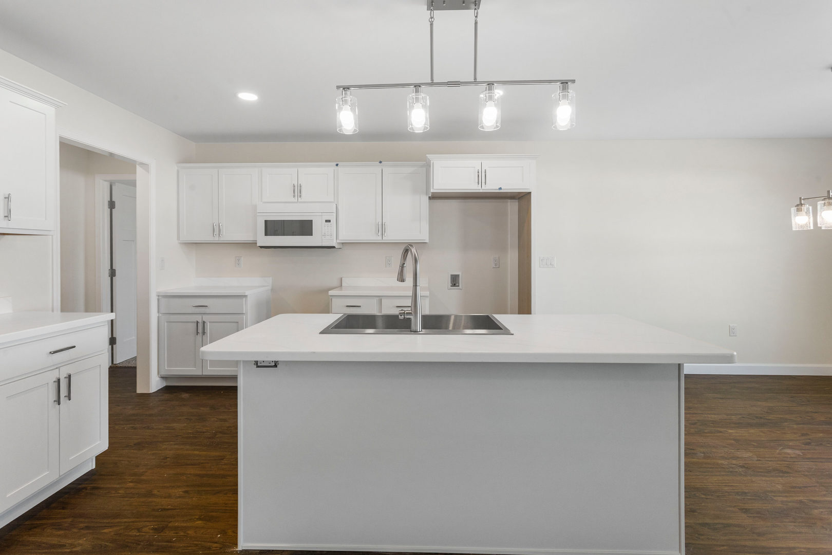 504 Patterson Drive Bloomington, IL 61701 - Photo 6 of 26 a kitchen with kitchen island a sink stainless steel appliances and cabinets