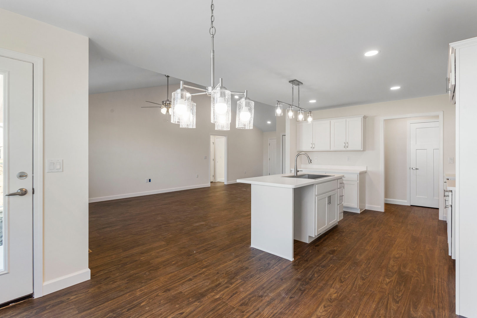 504 Patterson Drive Bloomington, IL 61701 - Photo 7 of 26 a large kitchen with granite countertop a large counter top a sink stainless steel appliances and cabinets